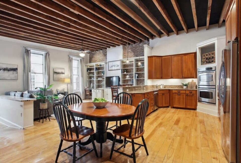 Dining Area | Open Concept Dining Area with Exposed Beam Ceiling | Third Floor of Building — Unit on One Level