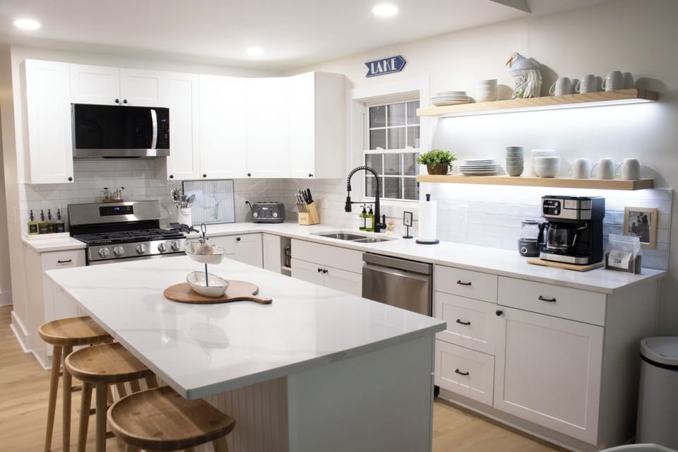 Kitchen dining: island seats 3 while table seats 8.