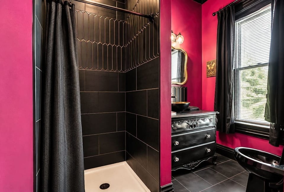 Full bathroom with a walk-in shower and gothic-inspired flair