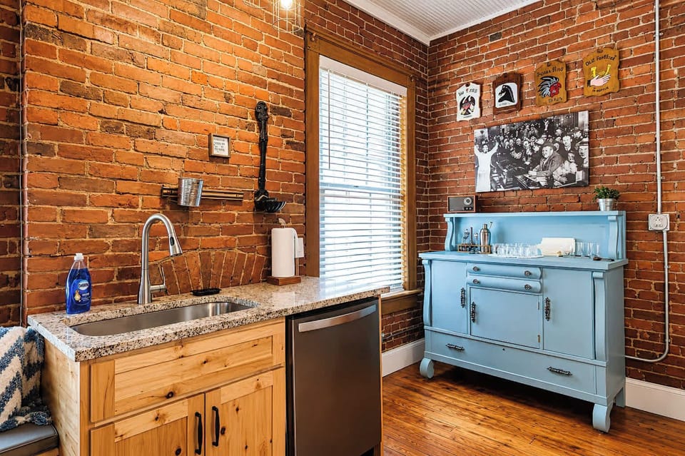 Spacious king bedroom with its own mini bar, sink, and fridge