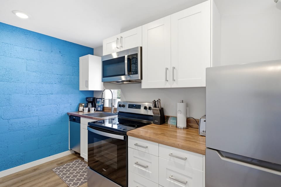 Bright, fully equipped kitchen with modern appliances.