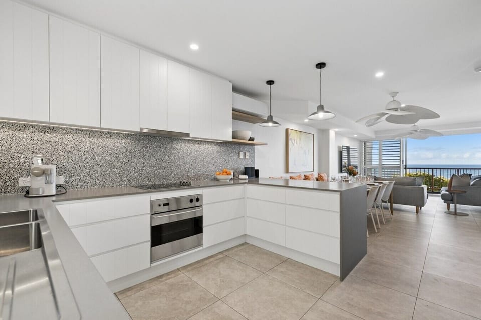 Fully equipped kitchen with island bench and Nespresso coffee machine