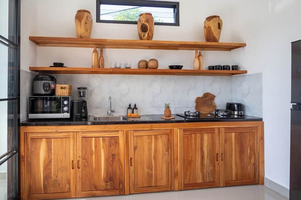 Our sentimental and autentic kitchen which completely with all equipments needed such as: toaster, microwave, blender, plate, bowl, spoon, fork and table knife, also cooking tools and all is NEW