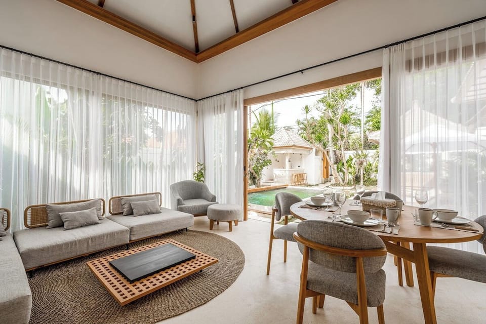 Living Room: Sun-soaked space with sleek furniture and stunning views of the lush garden!