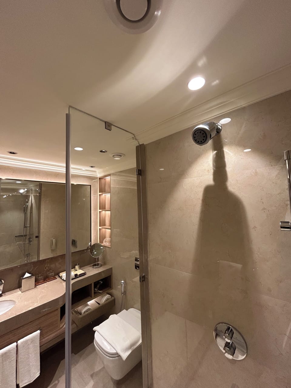 Shower, hair dryer, slippers, towels