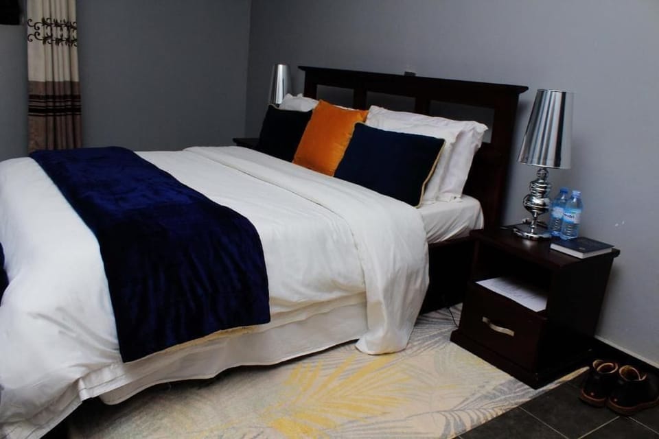 Family Room, Balcony, Garden View | Desk, blackout drapes, iron/ironing board (on request), WiFi (free)