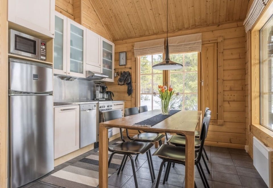 Well-equipped kitchen with a fridge-freezer, microwave, coffee maker and generous counter space.