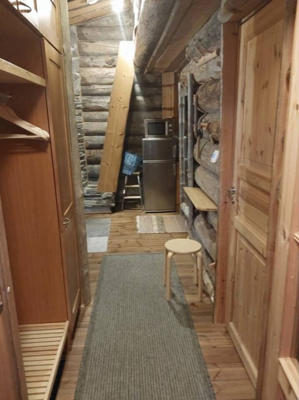 Entrance hall with a coat closet and room for outdoor gear.