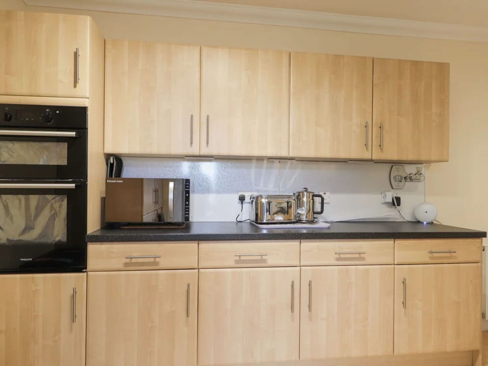 Cabinetry, Furniture, Wood, Kitchen, Countertop, Interior Design, Flooring, Cupboard, Drawer, Kitchen Appliance