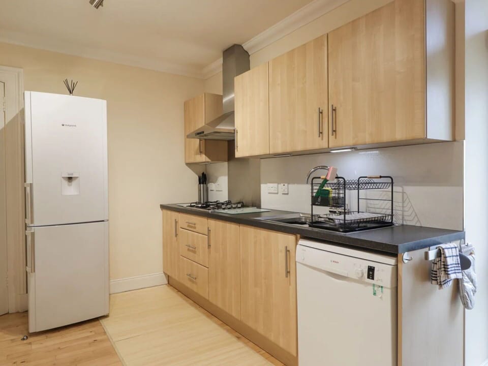 Furniture, Interior Design, Cabinetry, Flooring, Major Appliance, Kitchen Appliance, Wood, Kitchen, Countertop, Floor