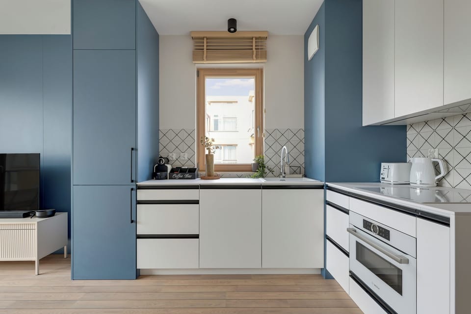 Deluxe Apartment, Balcony, Courtyard View | Private kitchenette | Coffee/tea maker, electric kettle, toaster, highchair