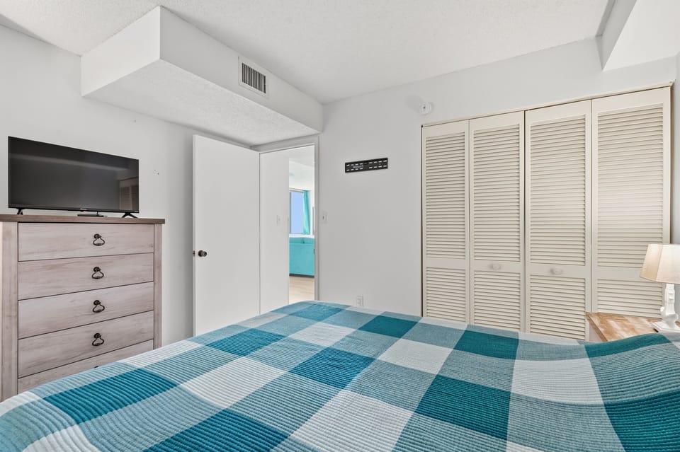 Slip into your comfortable bed after a day of exploring. This peaceful bedroom features ample closet space for all your belongings and a TV for your entertainment.