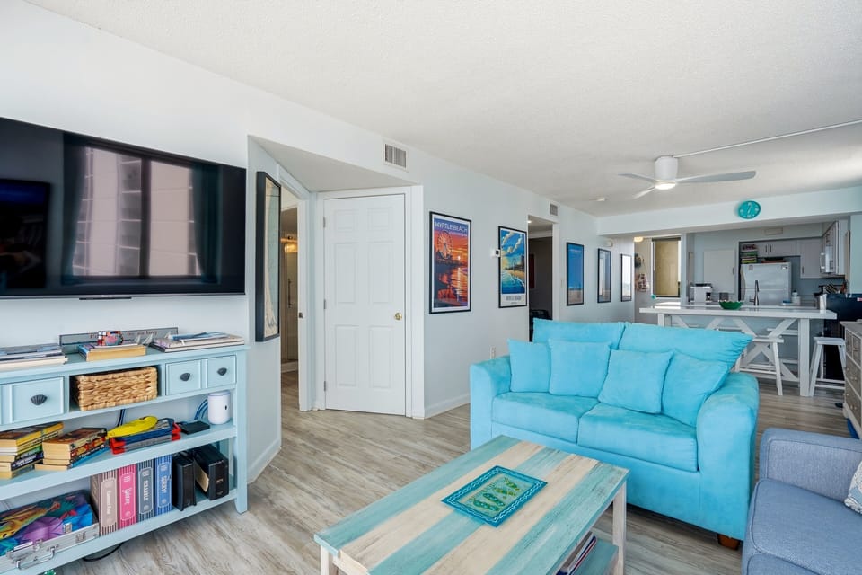 Relax in your bright open living space, where turquoise accents and beachy vibes invite you to kick back after a day exploring the coast.