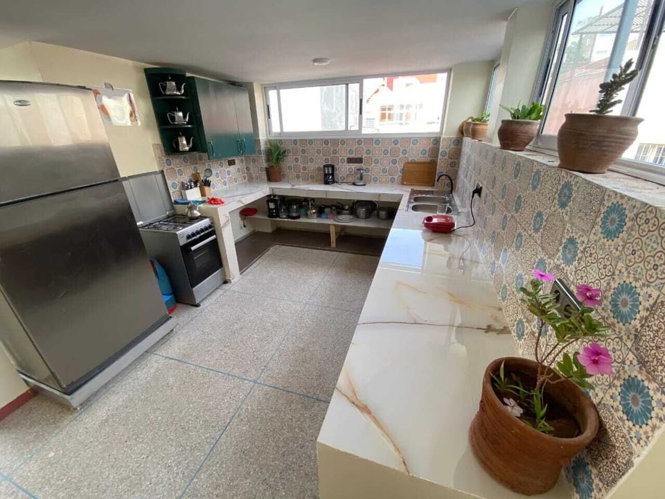 Full-size fridge, oven, stovetop, cookware/dishes/utensils