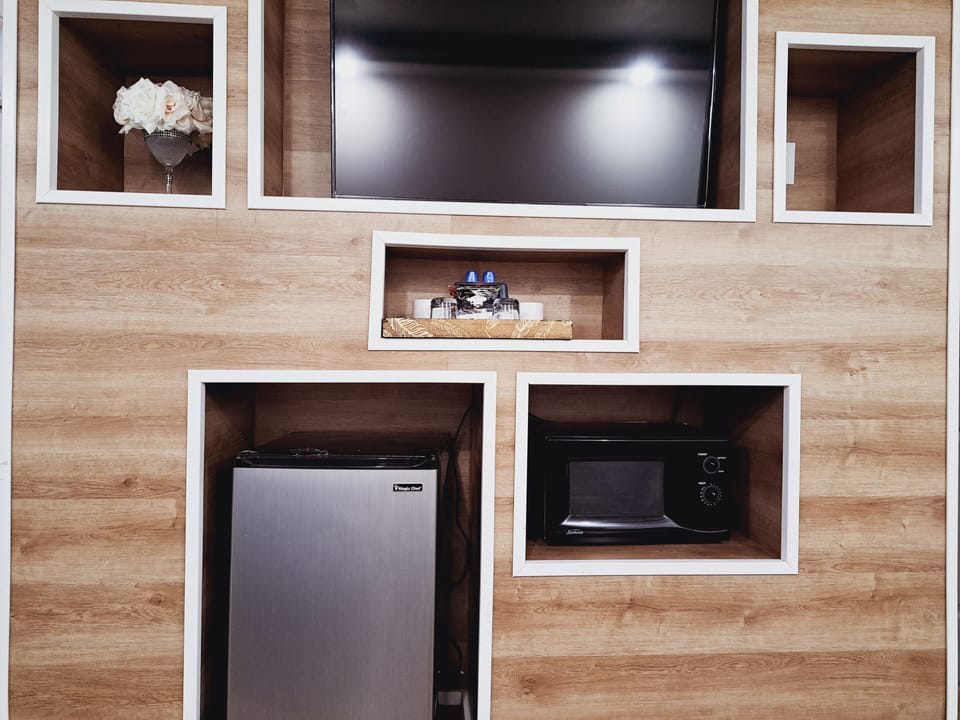 Standard Room, 2 Queen Beds | Living area | 35-inch LCD TV with cable channels, TV