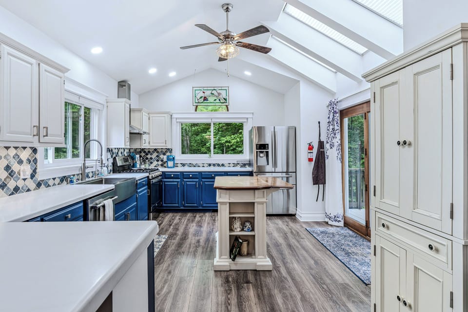 Bright, fully equipped kitchen with skylights and generous counter space
