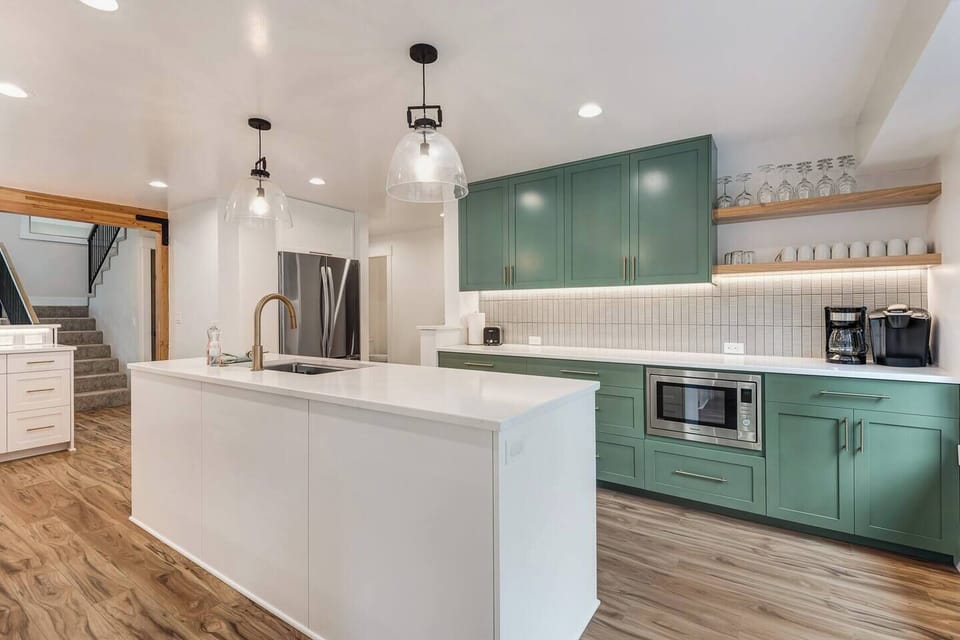 Fully updated kitchen with two sinks and extensive counter space.