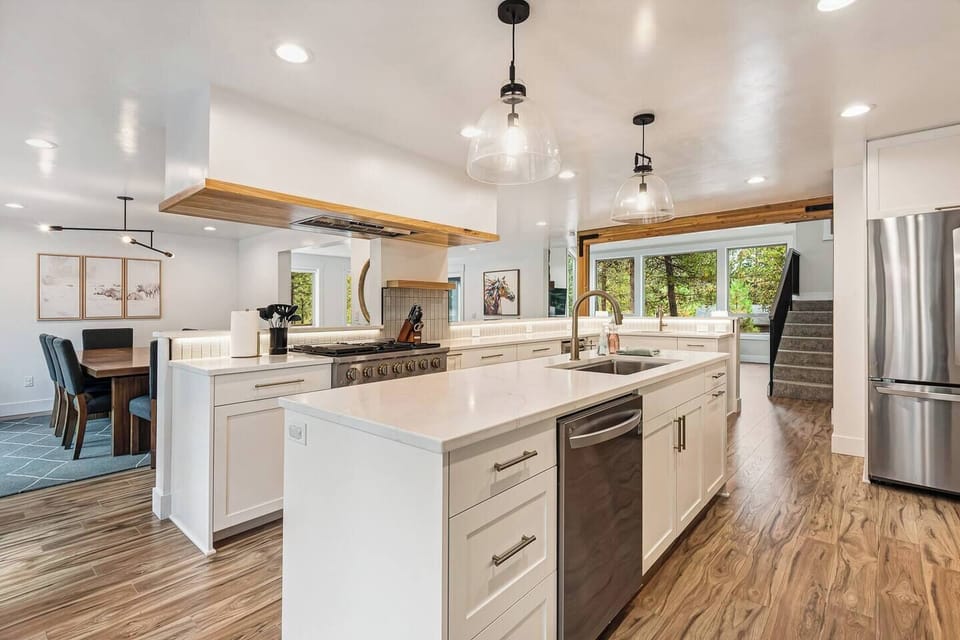 Fully updated kitchen with two sinks and extensive counter space.