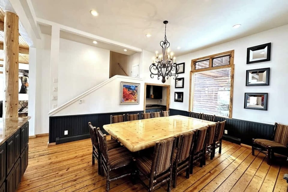 Dining area: Dining table with seating for 14, breakfast bar with 4 barstools