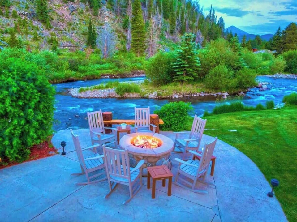 Fire pit: Outdoor propane gas fire pit with seating along the river