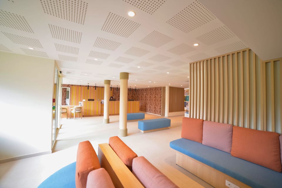 Reception area with seating and service desk.