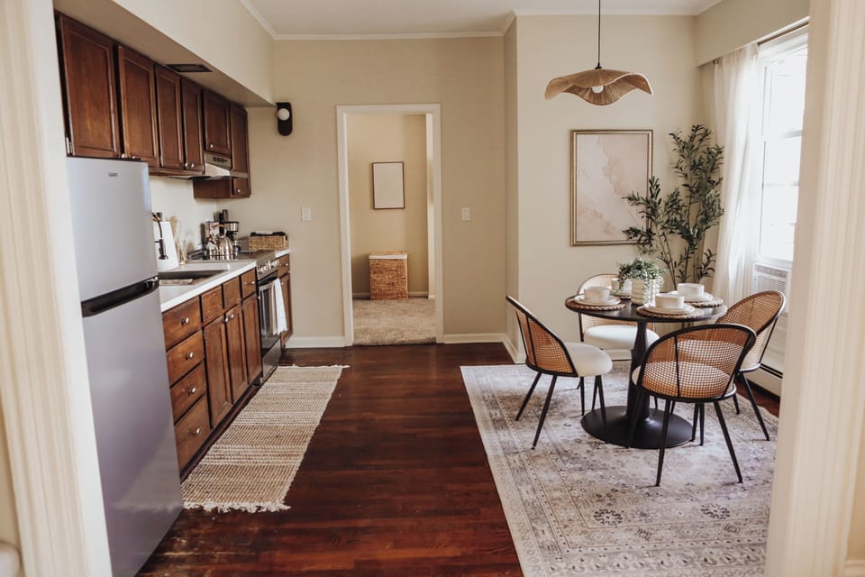 Bright kitchen and dining space with stylish seating for four