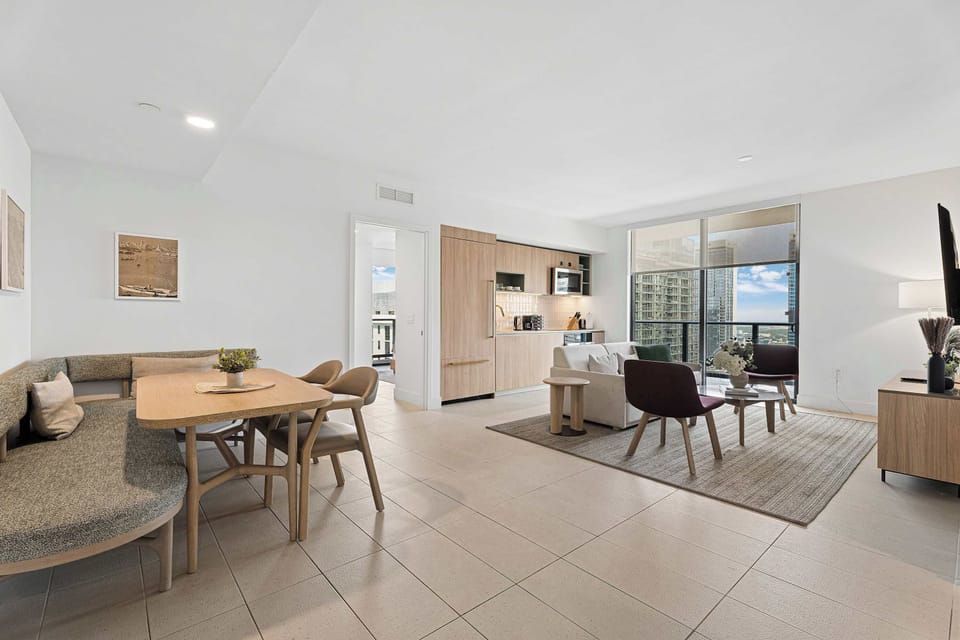 Open-concept layout featuring a cozy dining nook and sunlit living room.
