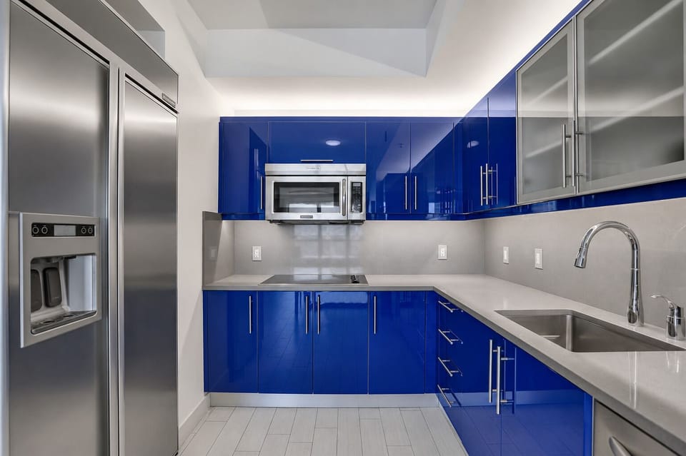 Full kitchen with stainless appliances + generous counter space
