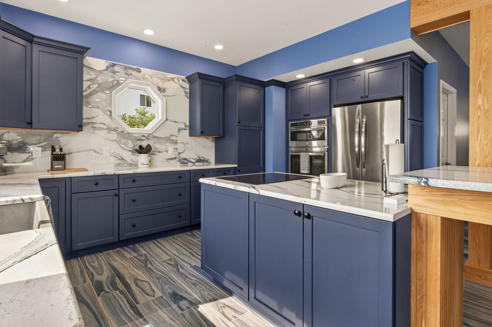 Full kitchen with island and stainless appliances