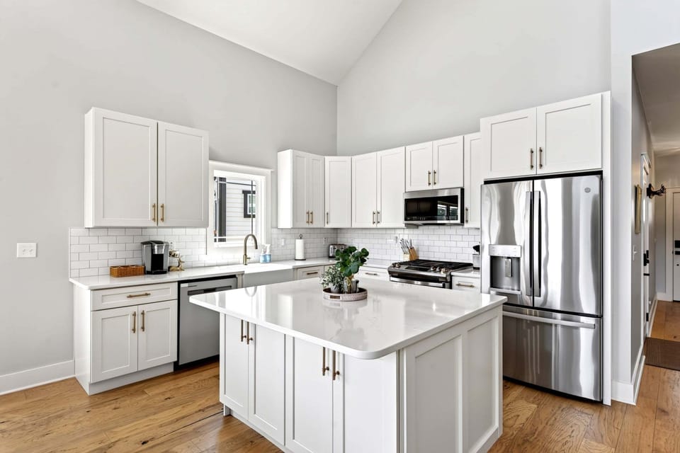Well-equipped kitchen with stainless appliances, dishwasher, and Keurig coffee maker.
