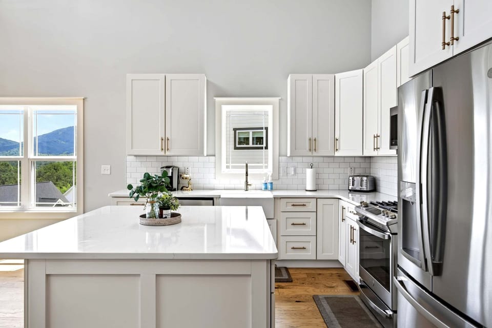 Well-equipped kitchen with stainless appliances, dishwasher, and Keurig coffee maker.