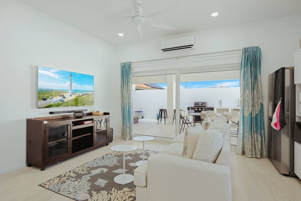 A bright and cozy living room with a comfortable space to relax after a day out.