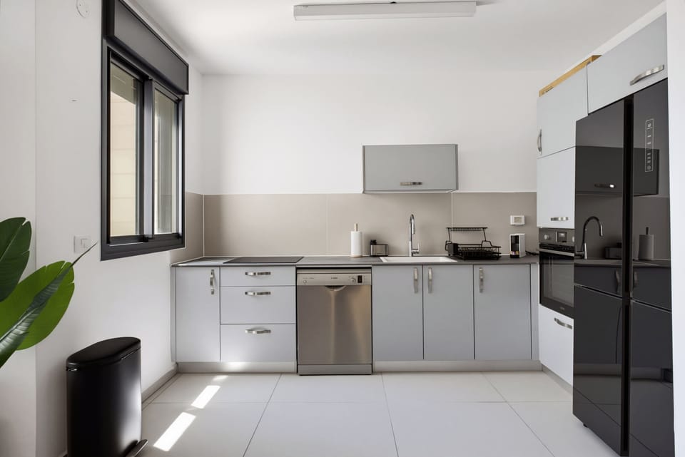 Cook delicious homemade dinners effortlessly using modern appliances inside this fully equipped bright kitchen.