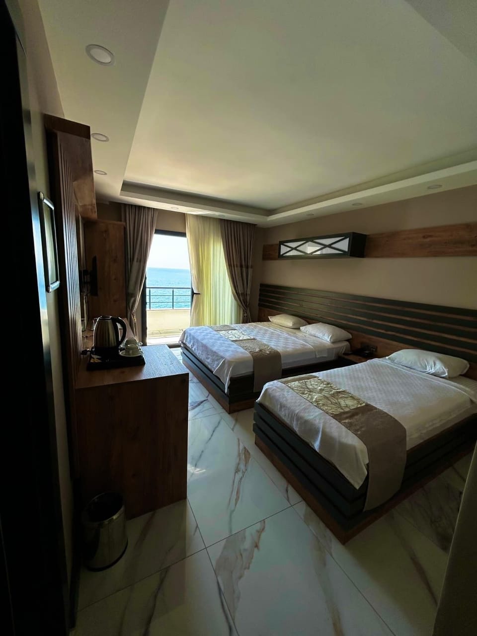 Deluxe Room, Balcony, Sea View | Minibar (free items), desk, laptop workspace, bed sheets