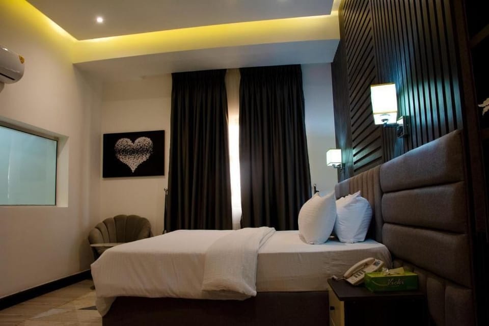 Family Room, Balcony, City View | In-room safe, desk, laptop workspace, blackout drapes