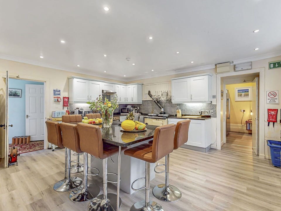 Furniture, Interior Design, Flooring, Wood, Ceiling, Floor, Lighting, Room, Table, Kitchen