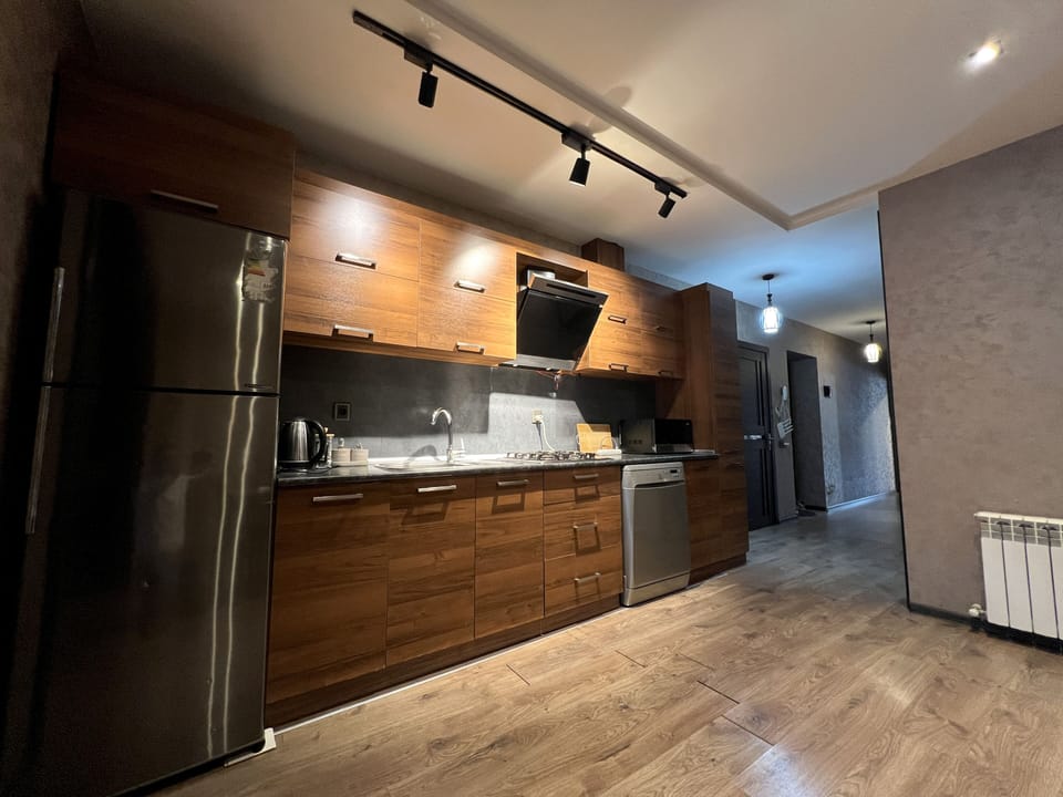 Wide view of the kitchen and adjoining dining area.