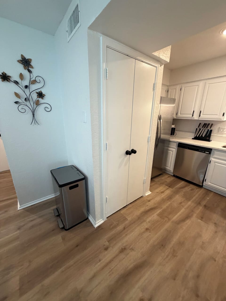 Bright kitchen with stainless appliances and handy extra storage