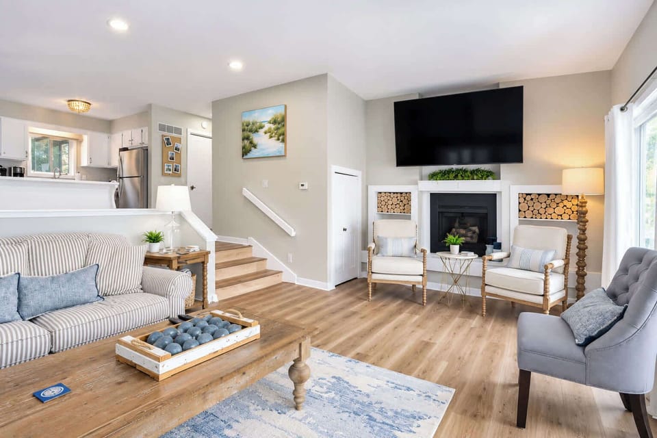 Settle in by the fireplace with easy access to the private balcony, sofa bed, lake views, and smart TV