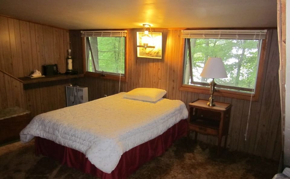 Bed in upstairs bedroom