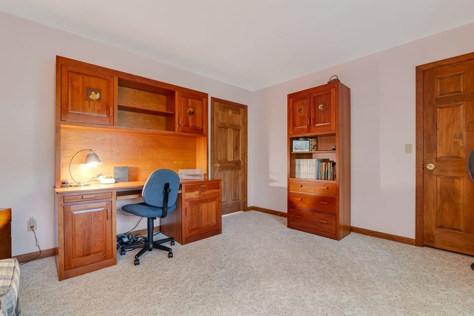 Additional bedroom with sofa bed doubles as office space