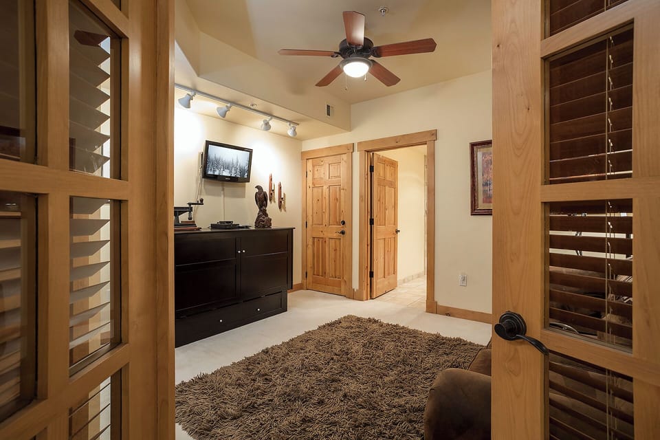Warm wood tones and vaulted ceilings create a cozy retreat where you can unwind after exploring nearby mountain trails and attractions.