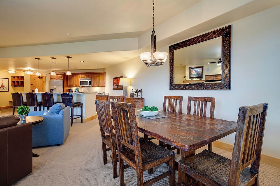 Gather around the rustic dining table for memorable meals, with your fully equipped kitchen and cozy living area flowing seamlessly together for effortless entertaining.