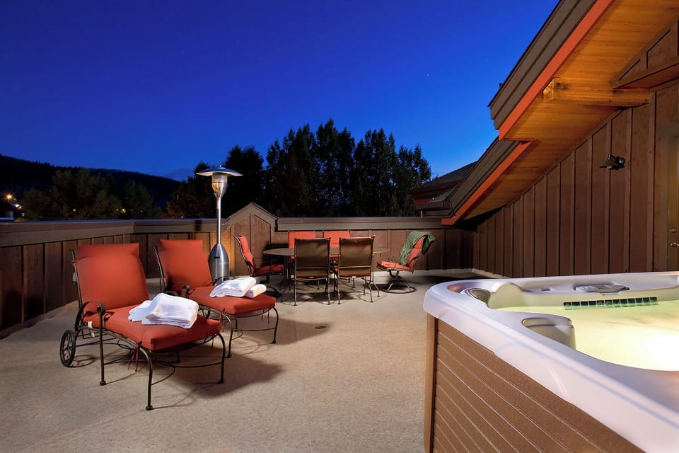 Unwind under the stars in your private hot tub, surrounded by plush lounge chairs and mountain air. Perfect for evening relaxation after a day of adventure.