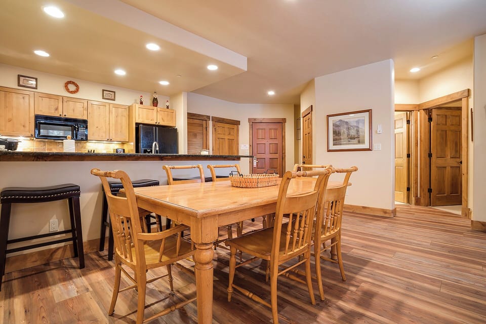 Gather around this beautiful solid wood dining table with seating for eight—your perfect spot for family meals, game nights, or morning coffee as you plan the day's adventures.