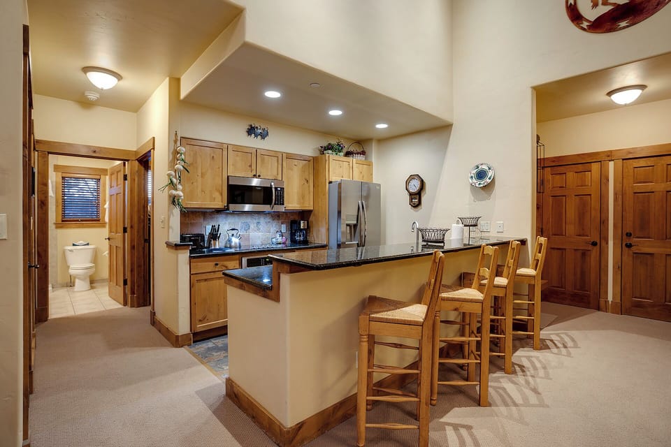 Step into your home-away-from-home with a welcoming open layout, full kitchen, and breakfast bar where you can gather with loved ones for meals and conversation.
