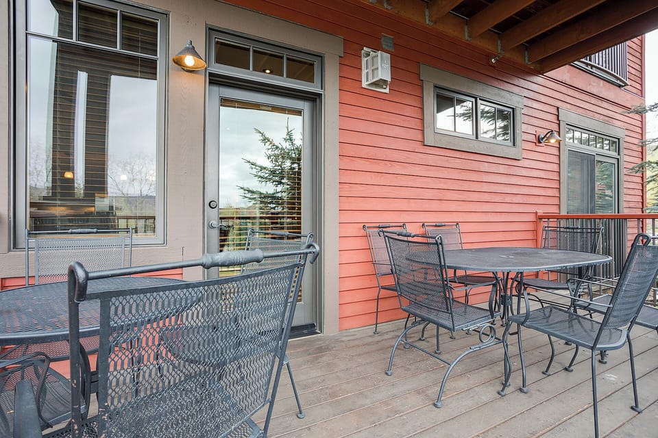 Your private outdoor deck offers mountain views and comfortable seating for morning coffee or evening relaxation with metal dining sets ready for al fresco meals.