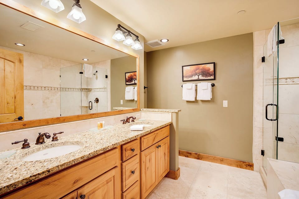 Step into your private spa-like retreat. Dual vanities and a spacious walk-in shower create the perfect space to unwind after a day of mountain adventures.