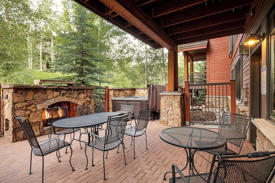 Gather around the outdoor fireplace on your private patio, where cozy seating and a hot tub invite you to unwind surrounded by aspen-lined tranquility and mountain air.
