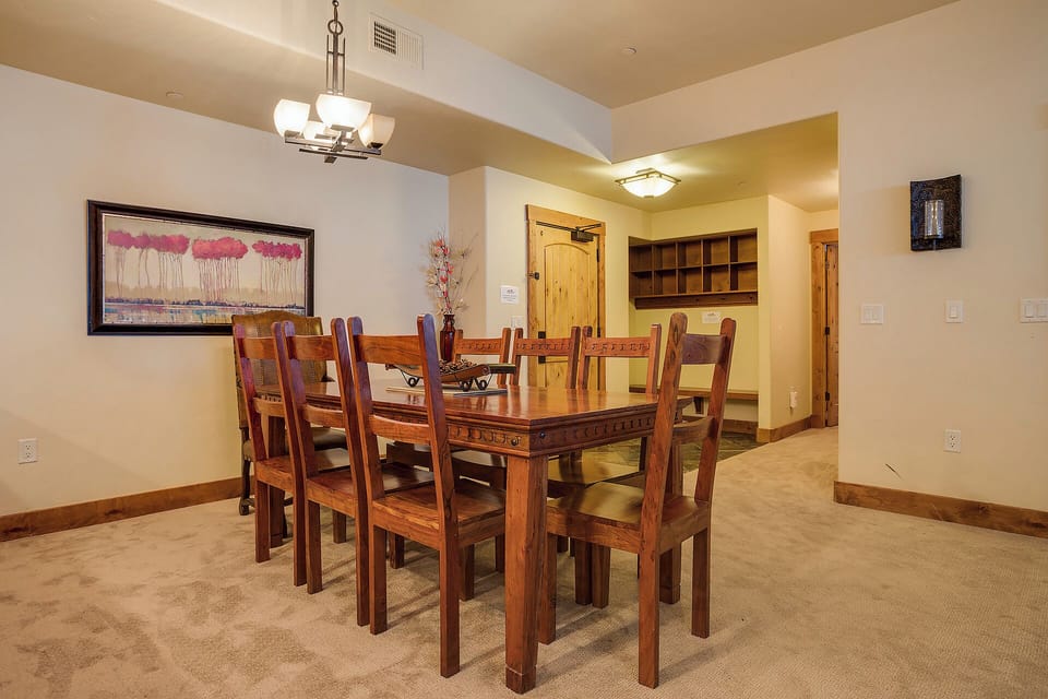 Gather around this handsome wooden dining table with seating for eight, perfect for sharing memorable meals and great conversations together.